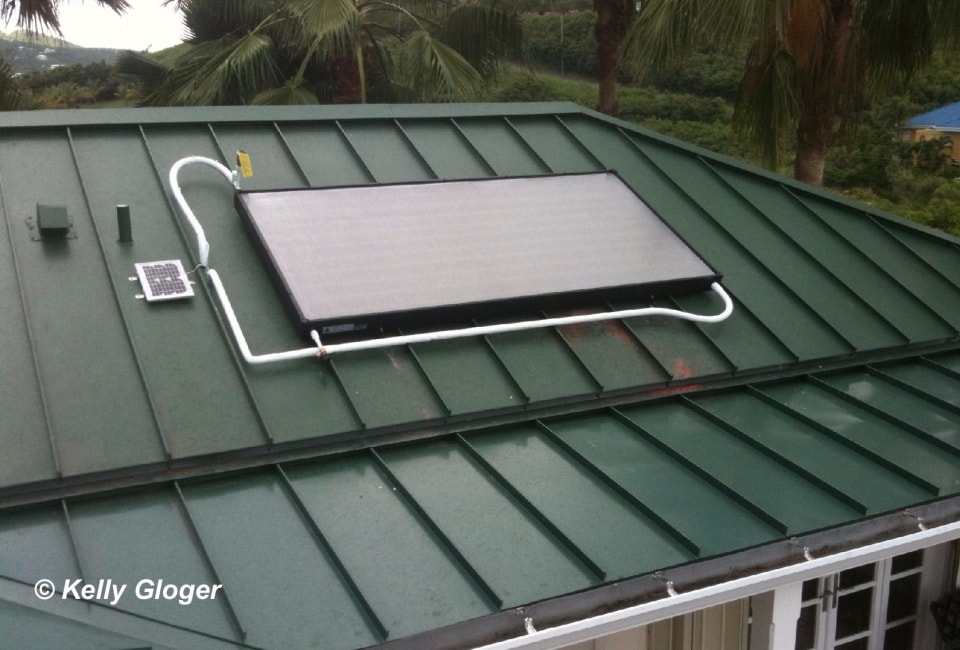 Solar hot water collector on green metal roof, St. Croix USVI