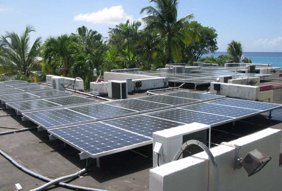 Sand Castle Hotel rooftop solar array with ocean view