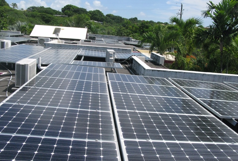 Sand Castle Hotel solar panels across multiple roof sections