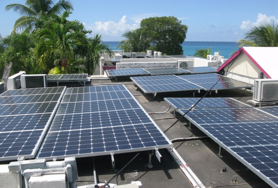 Sand Castle Hotel solar array with Caribbean sea in background
